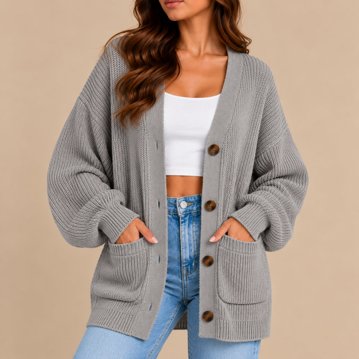 Women's oversized textured knit cardigan in grey – front view with patch pockets