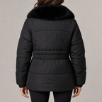 Women's puffer jacket with faux fur collar in black – back view