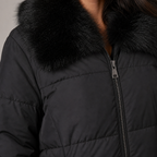 Women's puffer jacket with faux fur collar in black – detail close-up