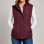 Women's quilted gilet with stand collar, zip and popper front in burgundy – front view