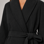 Women's relaxed-fit belted wrap coat with shawl collar and faux fur cuffs in black – detail close-up
